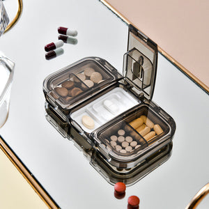 Boîte à pilules avec coupeur de médicaments